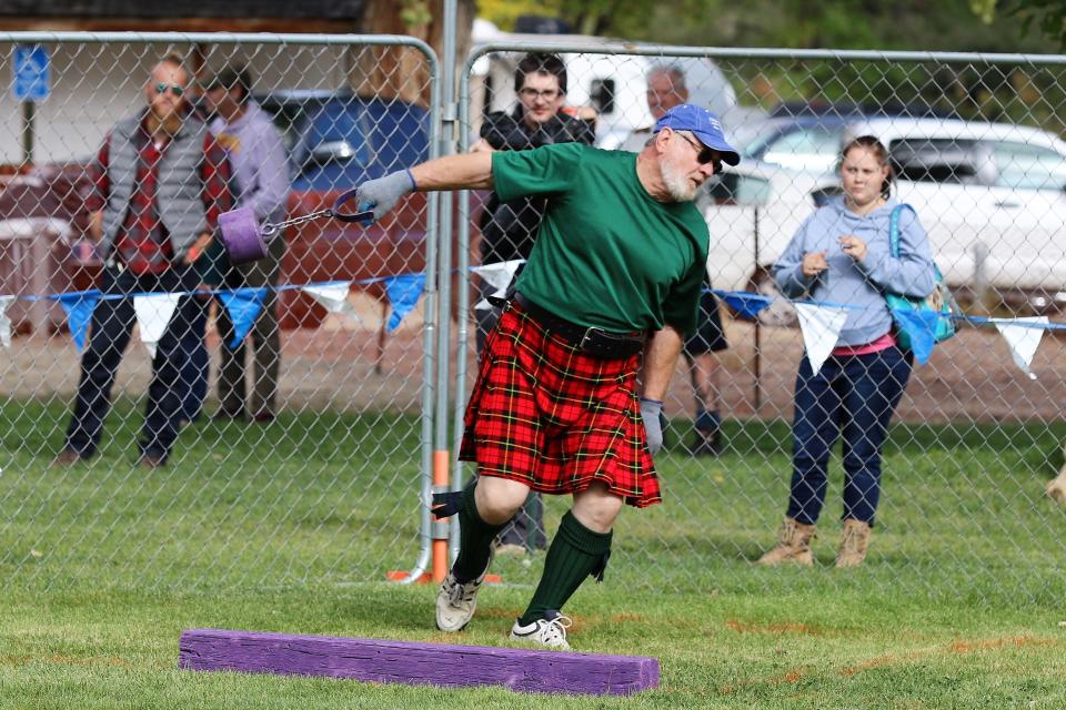 Joe Kozimor takes part in the weight over distance contest on Oct. 2 at the Aztec Highland Games and Celtic Festival at Riverside Park.