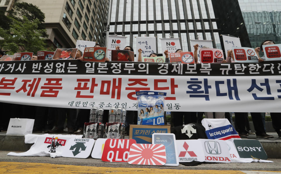 South Korean small and medium-sized business owners stage a rally calling for a boycott of Japanese products in front of the Japanese embassy in Seoul, South Korea, Monday, July 15, 2019. South Korea and Japan last Friday, July 12, failed to immediately resolve their dispute over Japanese export restrictions that could hurt South Korean technology companies, as Seoul called for an investigation by the United Nations or another international body. The signs read: "Our supermarket does not sell Japanese products." (AP Photo/Ahn Young-joon)