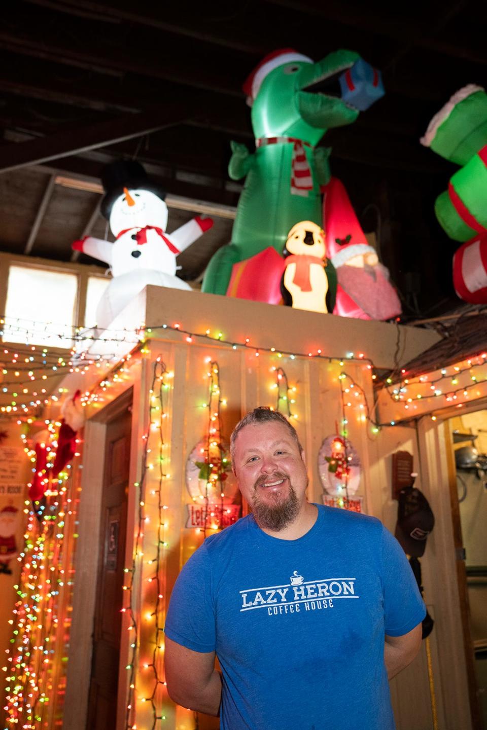 Todd Fitt, a regular-turned-employee at Donn's Depot, is in charge of the inflatable holiday figures that stand above the bar.