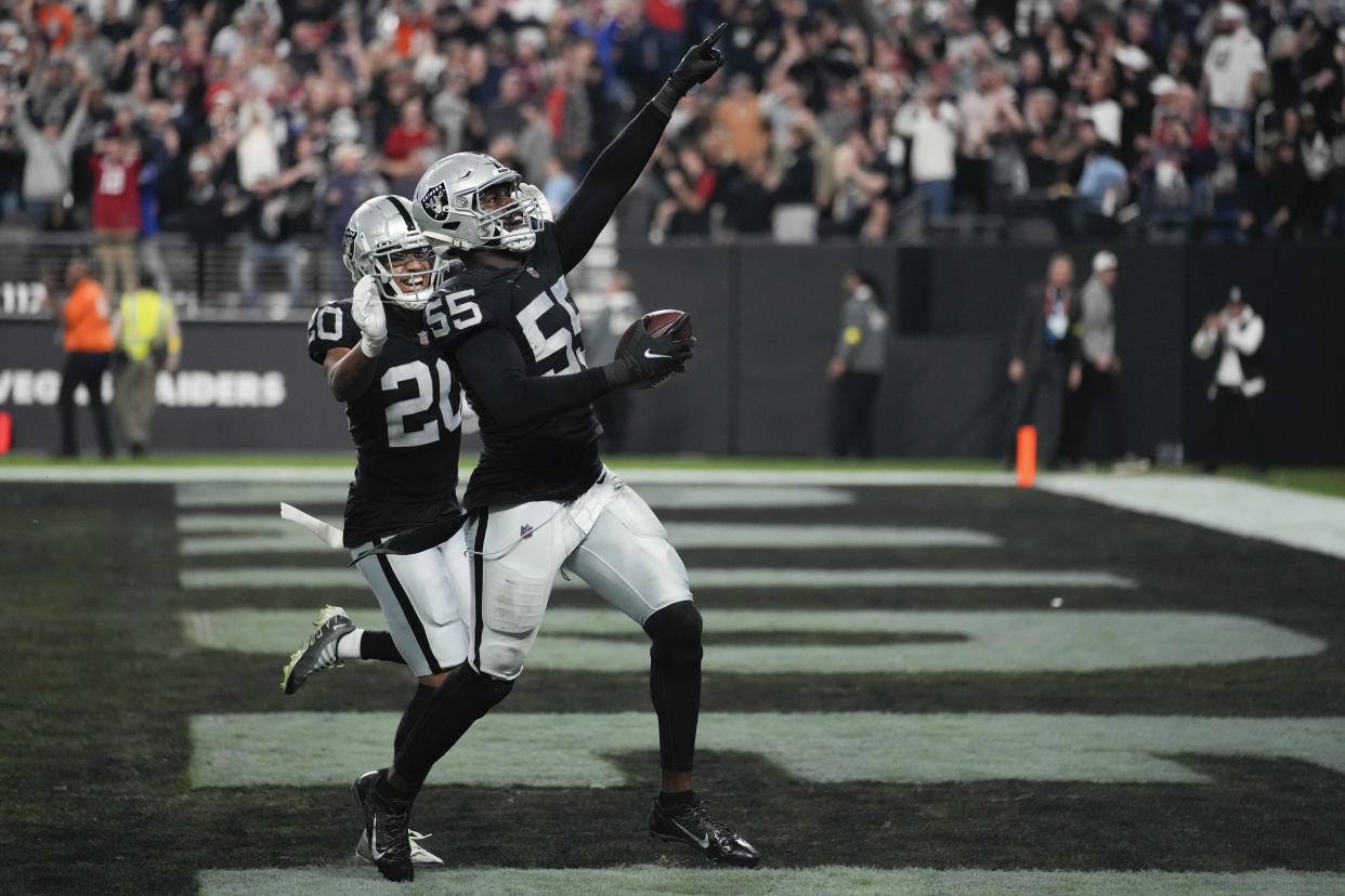 Las Vegas Raiders defensive end Chandler Jones (55) celebrates after scoring on an interception during the second half of an NFL football game between the New England Patriots and Las Vegas Raiders, Sunday, Dec. 18, 2022, in Las Vegas. The Raiders defeated the Patriots 30-24. (AP Photo/John Locher)