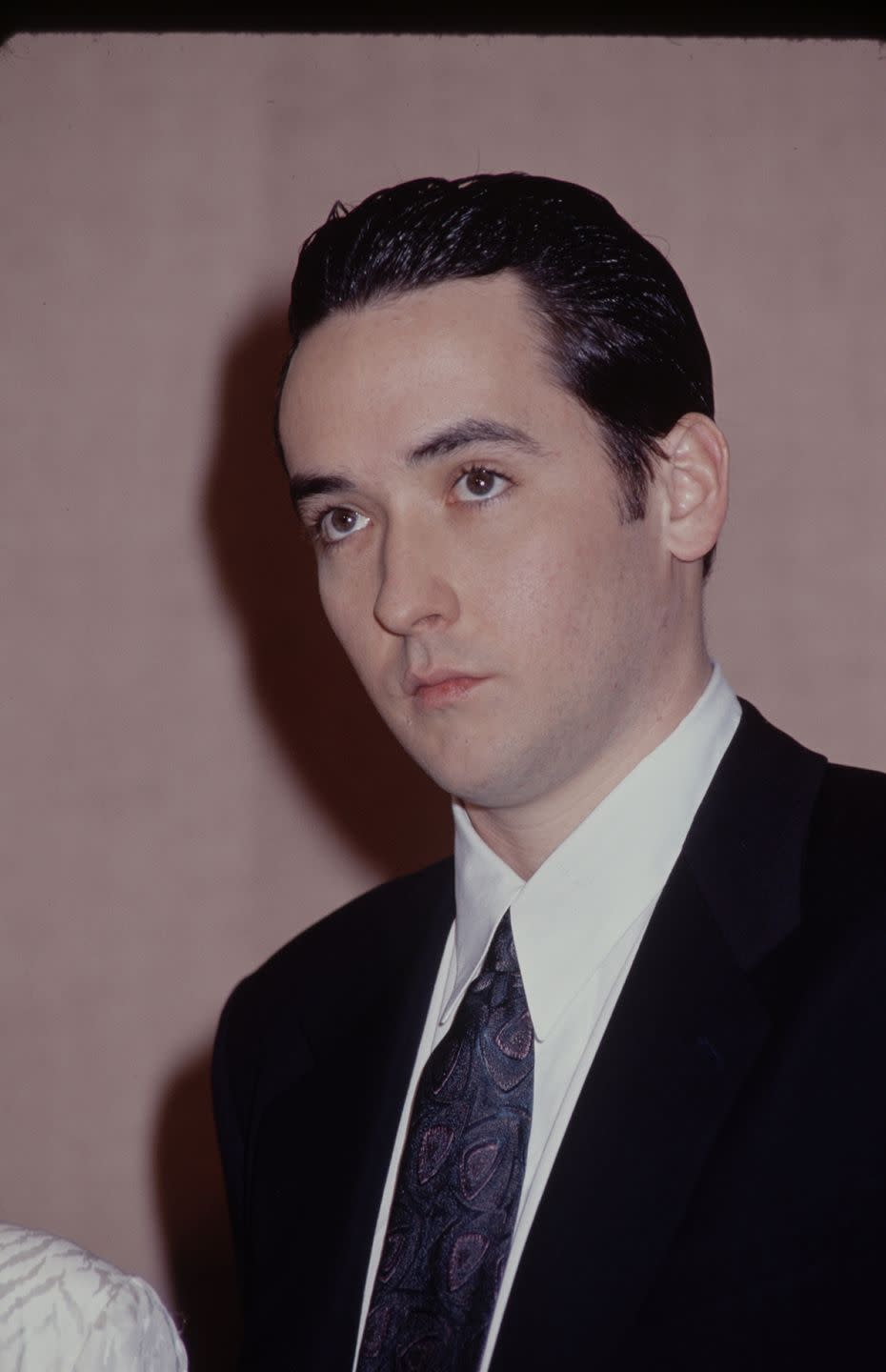 <p>This slicked-back style was a go-to during the mid to late '80s, but we're still not sure if anyone can pull it off quite like John Cusack. </p>