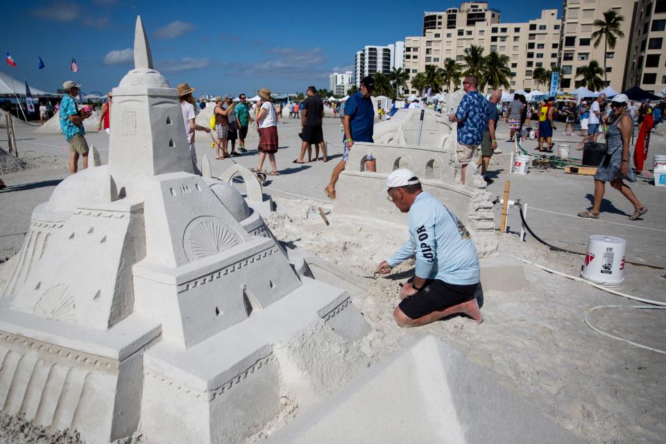 Charles Beaulieu works on his sand sculpture during the 33rd annual American Sand Sculpting Championship at Wyndham Garden Hotel in Fort Myers Beach on Sunday, November 24, 2019. 