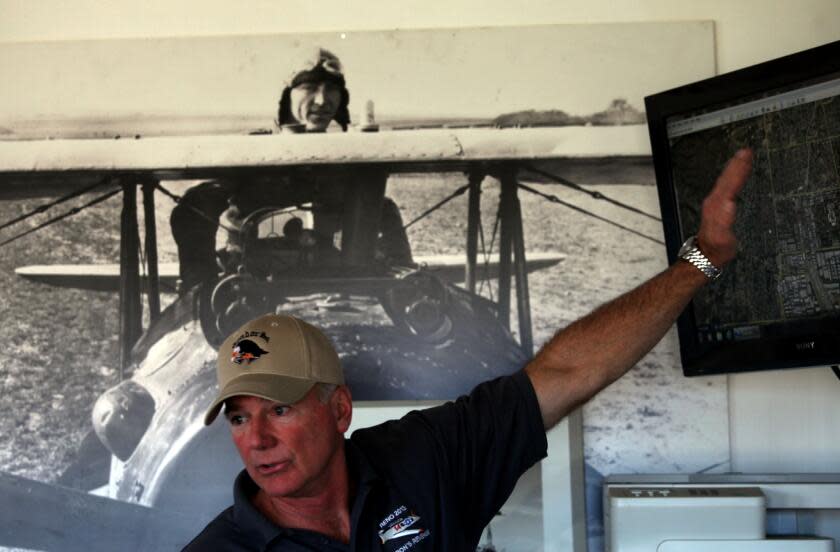 VAN NUYS, CA-DECEMBER 15, 2013: The Condor Squadron flies North American AT-6 WWII era planes out of Van Nuys airport. Chris Rushing goes over the flight plan during a briefing prior to their flyover of the Chatsworth parade and Malibu. (Michael Robinson Chavez/Los Angeles Times)