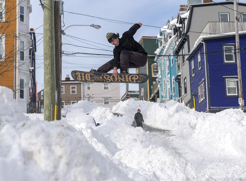 A snowboarder takes advantage of prime conditions in St. John's on Sunday, Jan. 19, 2020. The state of emergency ordered by the City of St. John's continues, leaving businesses closed and vehicles off the roads in the aftermath of the major winter storm that hit the Newfoundland and Labrador capital. THE CANADIAN PRESS/Andrew Vaughan