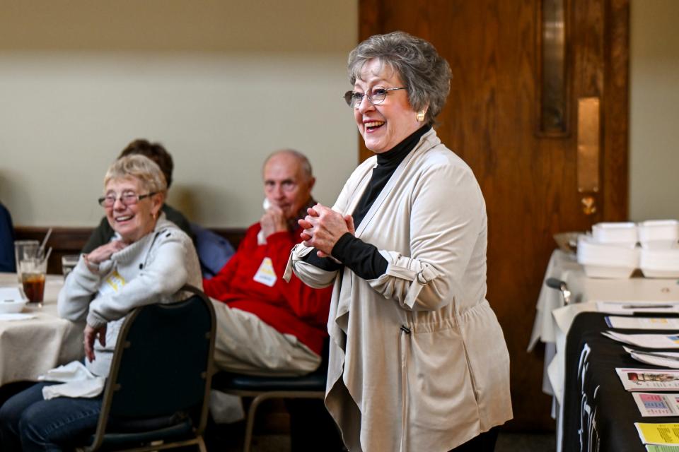 Life's Landscapes program director Debbie Sydlowski smiles while introducing the guest speaker during a Living Information For Today luncheon on Tuesday, April 23, 2024, at Coral Gables in East Lansing. The luncheon is one of several events that brings together those dealing with loss to offer social support.