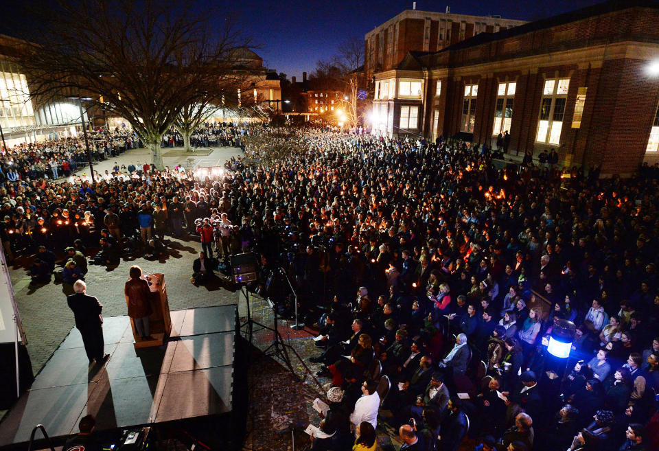 UNC-Chapel Hill Chancellor Carol Folt speaks to hundreds of mourners gathered in on the UNC campus in Chapel Hill, N.C., Wednesday, Feb. 11, 2015. A