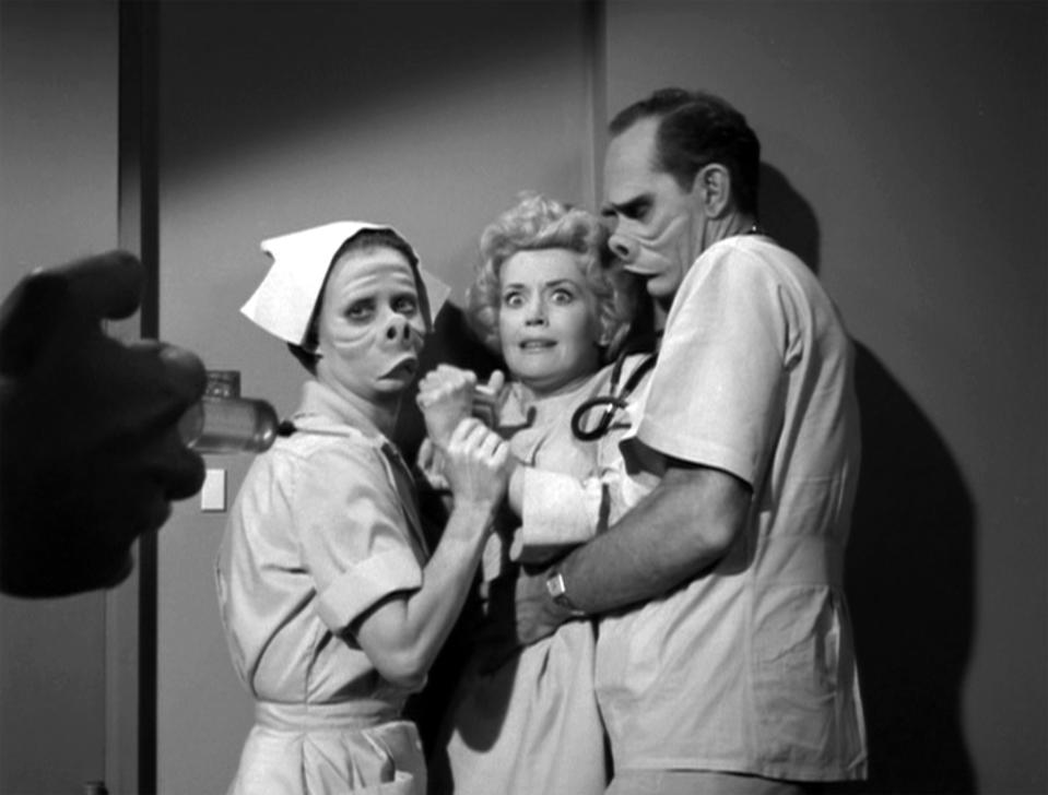 LOS ANGELES - NOVEMBER 11: Twilight Zone episode 'Eye of the Beholder', written by Rod Serling. Donna Douglas as patient Janet Tyler being held by William D. Gordon as the doctor. Originally broadcast on November 11, 1960. Season 2, episode 6. Image is a frame grab. (Photo by CBS via Getty Images)