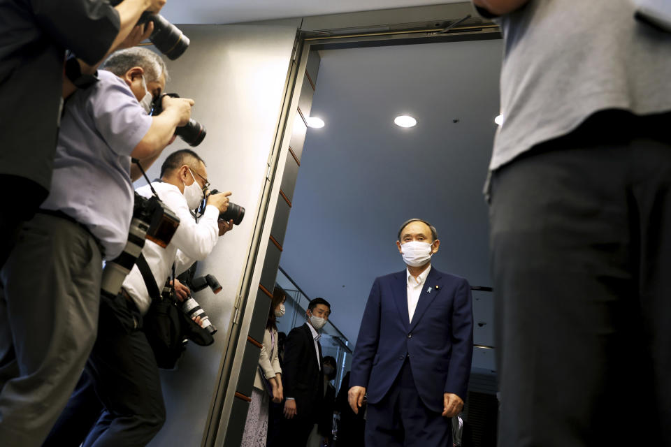 Japanese Primm Minister Yoshihide Suga arrives to meet International Paralympic Committee President Andrew Parsons, in Tokyo Friday, Sept.3, 2021. Suga said Friday he won’t run for leadership of the governing party at the end of this month, paving the way for a new Japanese leader after just a year in office. (Behrouz Mehri/Pool Photo via AP)