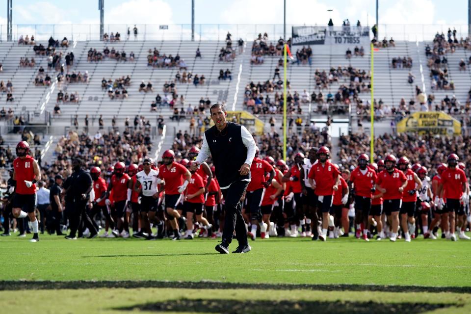 Cincinnati Bearcats head coach Luke Fickell jogs to the locker room before a college football game against the UCF Knights, Saturday, Oct. 29, 2022, at FBC Mortgage Stadium in Orlando, Fla. The UCF Knights lead at halftime, 10-6.