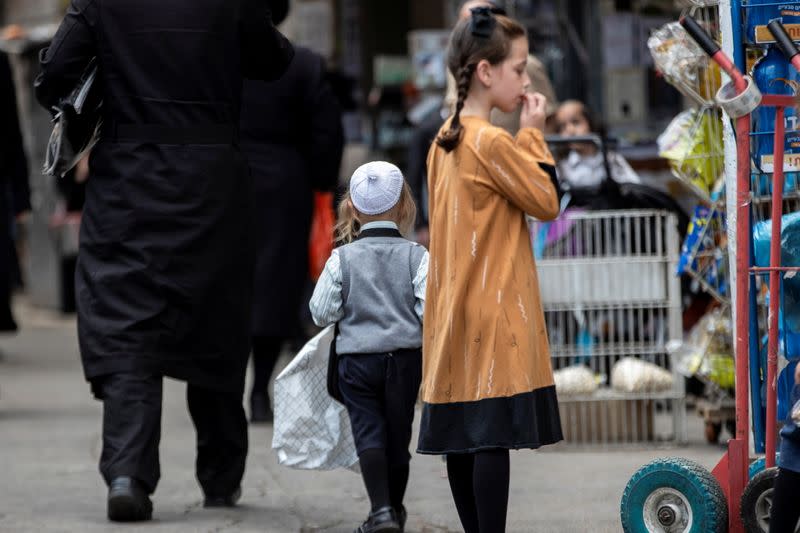 Ultra Orthodox Jews walk in a street in Jerusalem