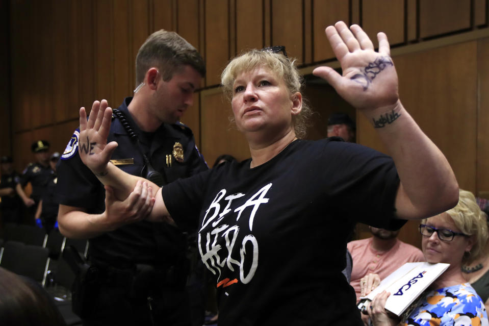 <span class="s1">A protester is removed from the hearing room as Brett Kavanaugh testifies before the Senate Judiciary Committee on Wednesday. (Photo: Manuel Balce Ceneta/AP)</span>