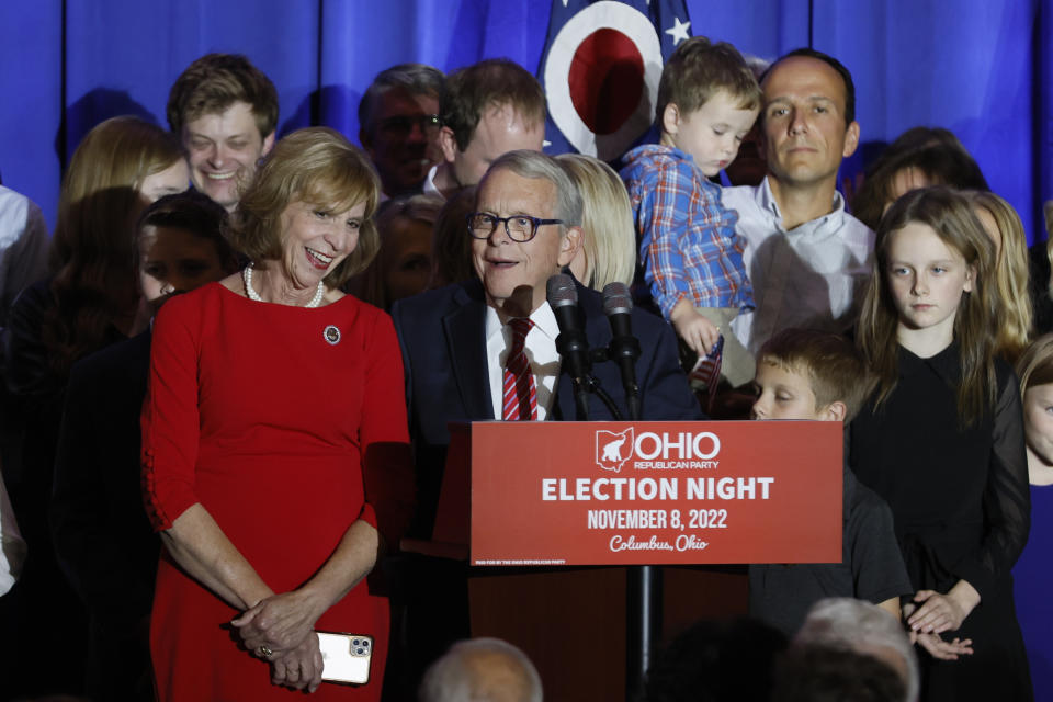 Republican Ohio Gov. Mike DeWine, right, speaks during an election night watch party as his wife, Fran, and their family stand on stage Tuesday, Nov. 8, 2022, in Columbus, Ohio. (AP Photo/Jay LaPrete)