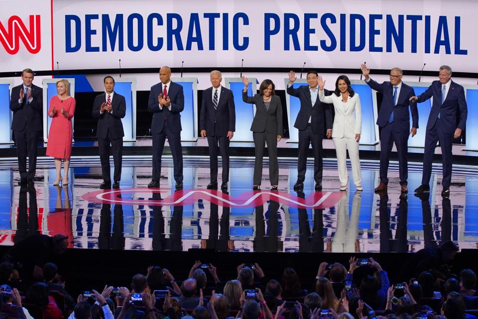 Candidates take the stage before the start of the second night of the Democratic presidential debates at the Fox Theatre in Detroit on Wednesday, July 31, 2019.