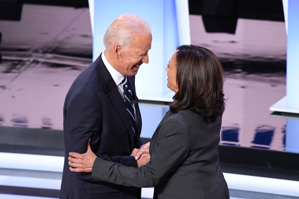 Former Vice President Joe Biden and Sen. Kamala Harris greet each other ahead of the second round of the second Democratic primary debate of the 2020 presidential campaign season at the Fox Theatre in Detroit on July 31, 2019.