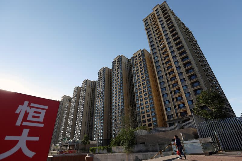 FILE PHOTO: An Evergrande sign is seen near residential buildings at an Evergrande residential complex in Beijing