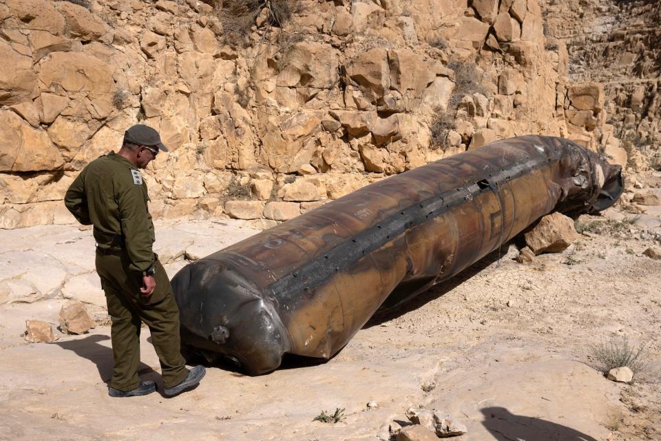 An Israeli soldier examines part of an Iranian ballistic missile fired during Iran's direct attack on Israel in April.