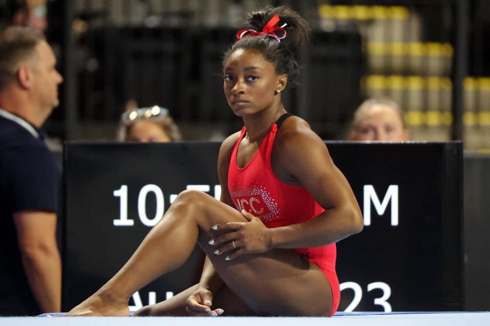 Simone Biles looks on during podium training before the U.S. Classic.