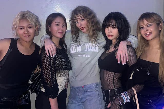 <p>Lisa/Instagram</p> Taylor Swift poses with BLACKPINK's Lisa and her friends backstage at her Eras Tour show in Singapore