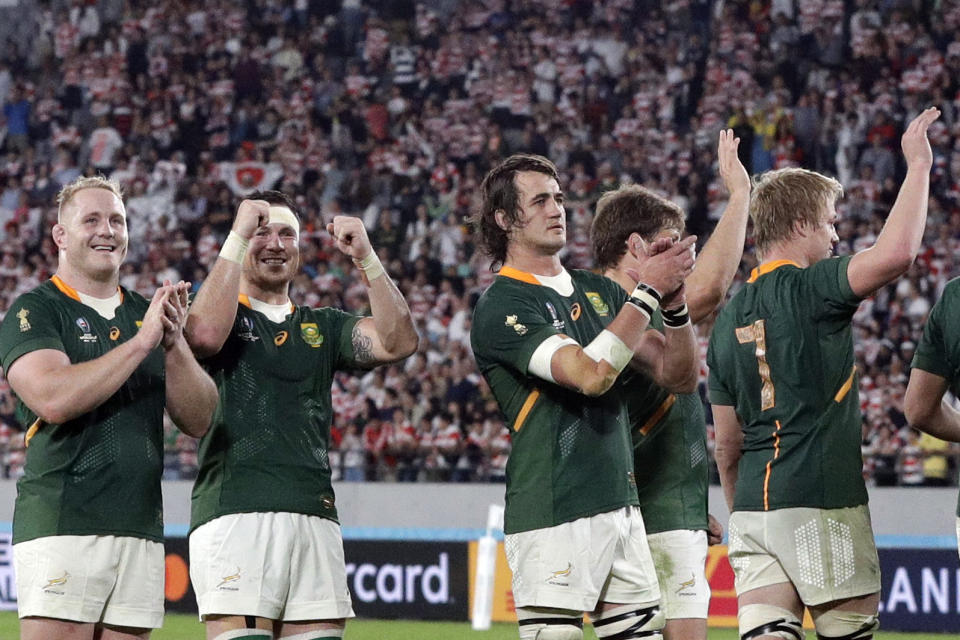 South Africa players celebrates after defeating Japan during the Rugby World Cup quarterfinal match at Tokyo Stadium between Japan and South Africa in Tokyo, Japan, Sunday, Oct. 20, 2019. (AP Photo/Mark Baker)