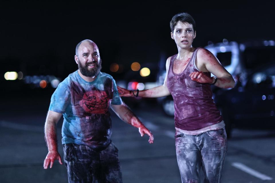 This film publicity image released by Radius-TWC shows, Nicolas Martinez, left, and Andrea Osvart in a scene from "Aftershock." (AP Photo/Radius-TWC)