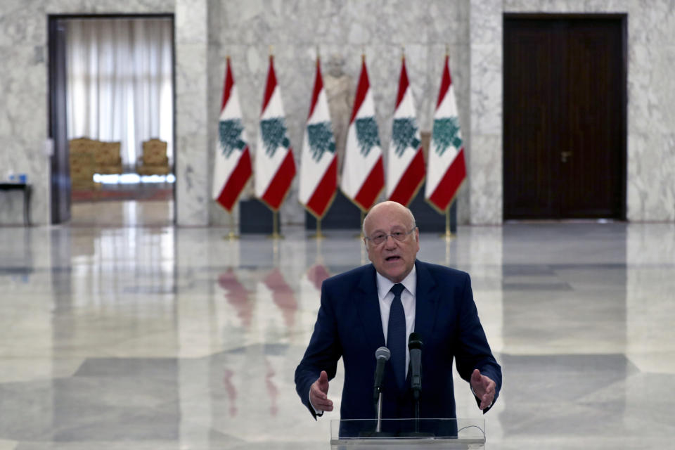 Lebanese Prime Minister-designate Najib Mikati, speaks to journalists after his meeting with Lebanese President Michel Aoun, at the Presidential Palace in Baabda, east of Beirut, Lebanon, Monday, July 26, 2021. Aoun appointed Mikati, a billionaire businessman and former prime minister as the next premier-designate Monday, after Saad Hariri earlier this month gave up attempts to form a Cabinet amid an unprecedented financial meltdown roiling the country. (AP Photo/Bilal Hussein)