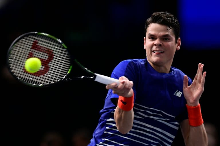 Canada's Milos Raonic returns the ball to France's Jo-Wilfried Tsonga during their quarter-final match at the ATP World Tour Masters 1000 indoor tournament in Paris, on November 4, 2016