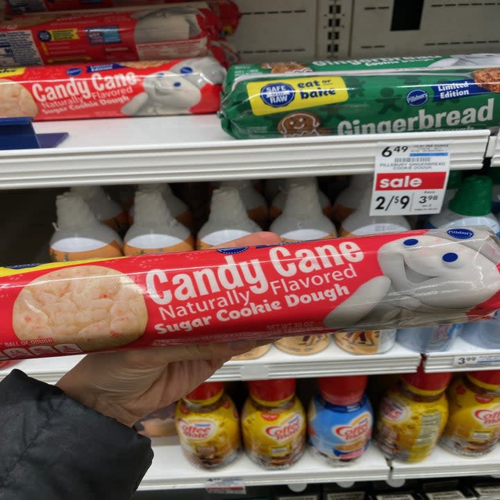 Holding log of candy cane cookie dough