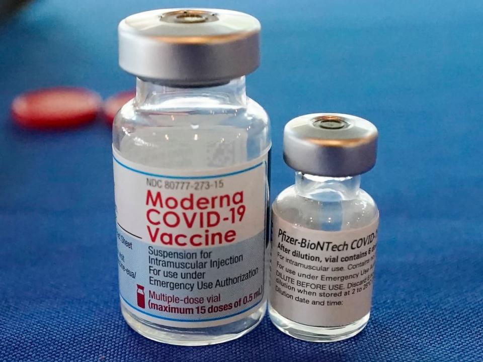 This Sept. 21, 2021 file photo shows vials of the Pfizer and Moderna COVID-19 vaccines. (Rogelio V. Solis/AP Photo - image credit)