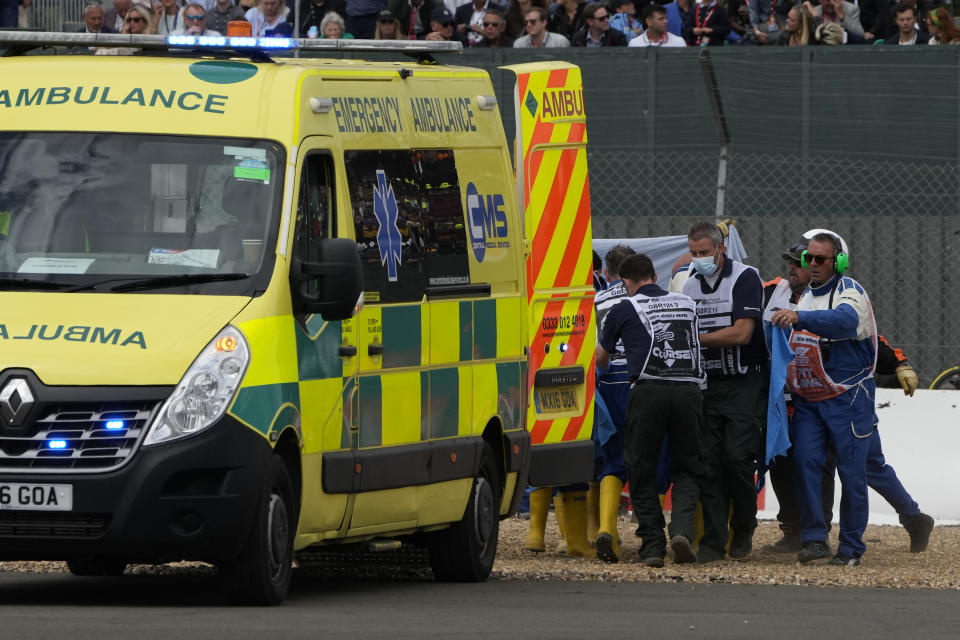 Alfa Romeo driver Guanyu Zhou of China is taken to ambulance during the British Formula One Grand Prix at the Silverstone circuit, in Silverstone, England, Sunday, July 3, 2022. (AP Photo/Matt Dunham, Pool)