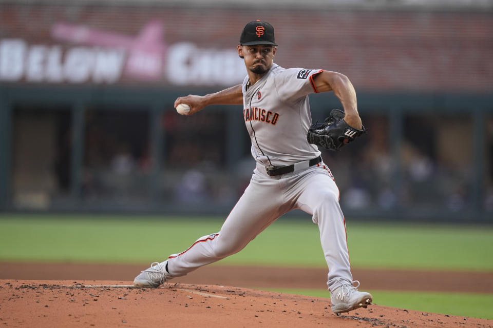 San Francisco Giants pitcher Jordan Hicks (12) delivers in the first inning of a baseball game against the Atlanta Braves, Wednesday, July 3, 2024, in Atlanta. (AP Photo/Brynn Anderson)