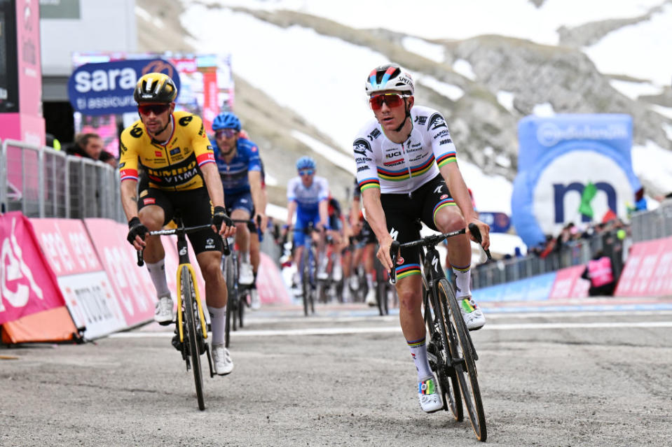 GRAN SASSO DITALIA  CAMPO IMPERATORE ITALY  MAY 12 LR Primo Rogli of Slovenia and Team JumboVisma and Remco Evenepoel of Belgium and Team Soudal  Quick Step cross the finish line during the 106th Giro dItalia 2023 Stage 7 a 218km stage from Capua to Gran Sasso dItalia Campo Imperatore 2123m  UCIWT  on May 12 2023 in Gran Sasso dItalia Campo Imperatore Italy Photo by Stuart FranklinGetty Images