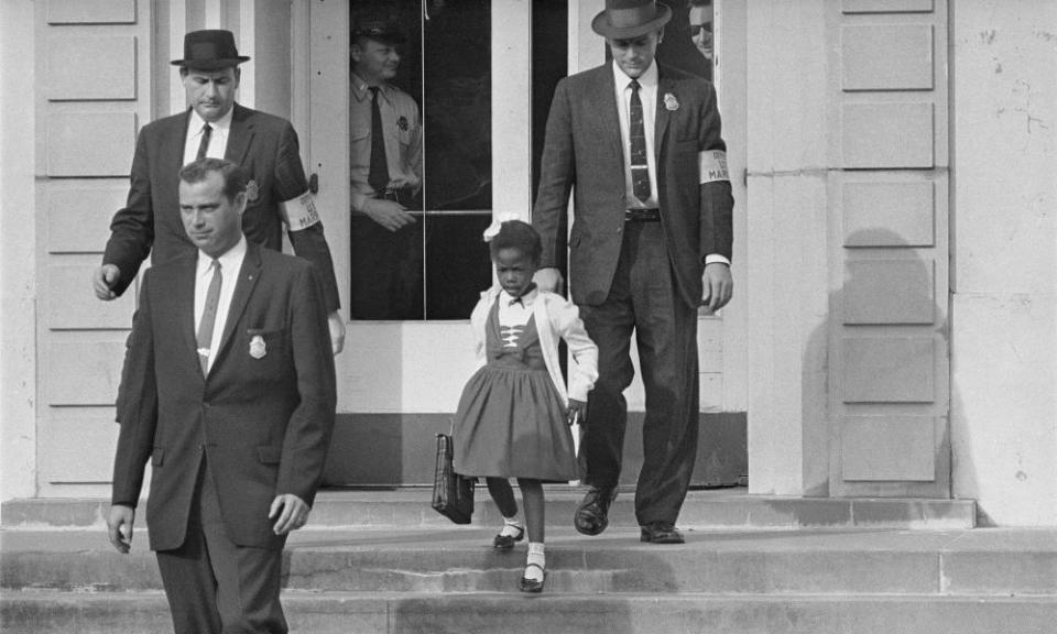 US deputy marshals escort six-year-old Ruby Bridges from William Frantz elementary school in New Orleans in 1960.