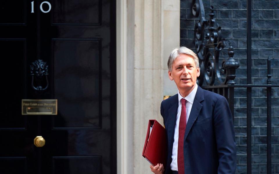 Britain's Chancellor of the Exchequer Philip Hammond  - Credit: AFP/NIKLAS HALLE'N