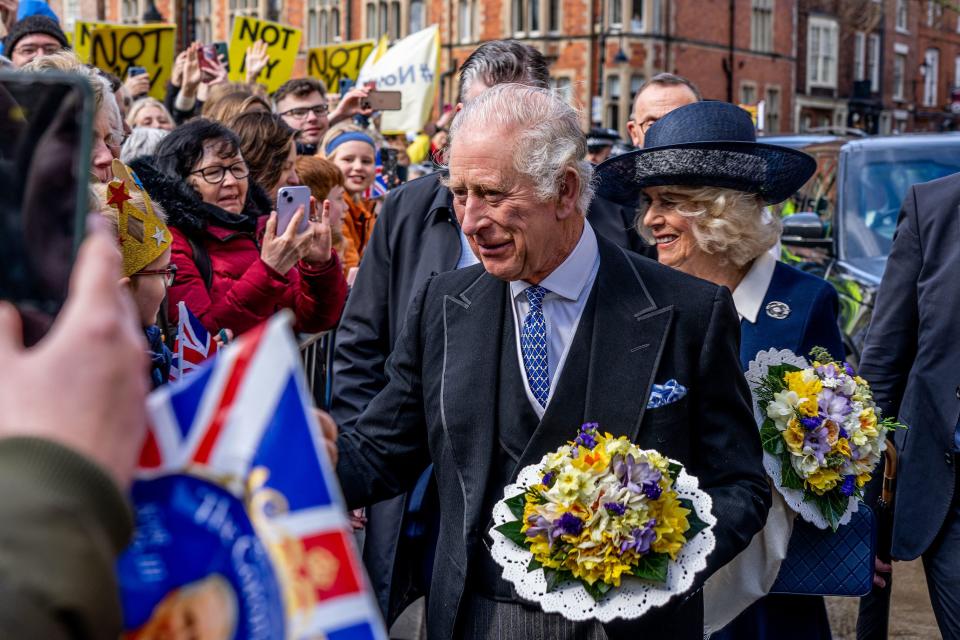 King Charles III and Queen Camilla speak with well-wishers after attend the Royal Maundy Service (POOL/AFP via Getty Images)