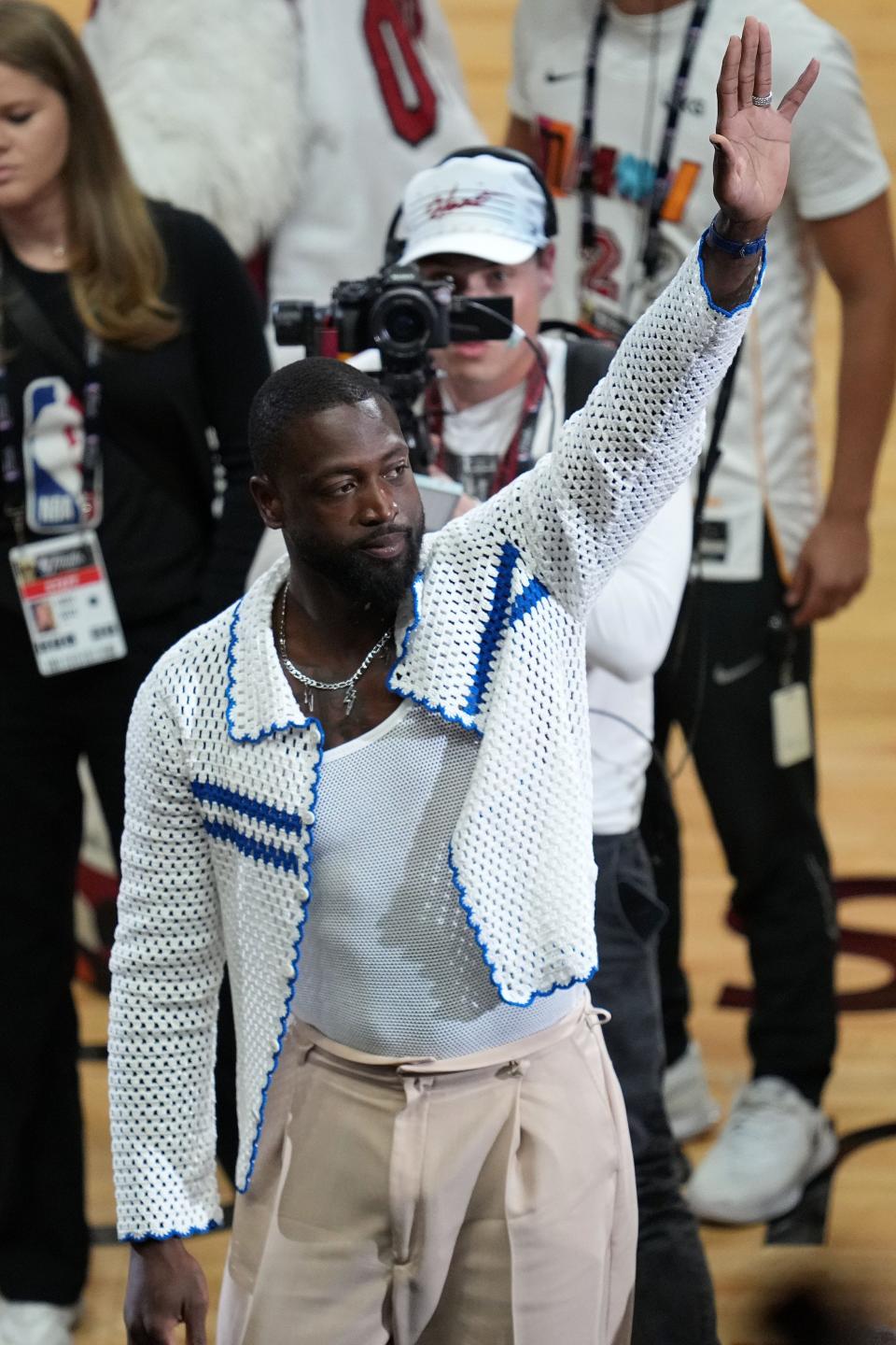 Jun 7, 2023; Miami, Florida, USA; Former Miami Heat player Dwayne Wade reacts to the crowd during the first quarter in game three of the 2023 NBA Finals at Kaseya Center. Mandatory Credit: Jim Rassol-USA TODAY Sports