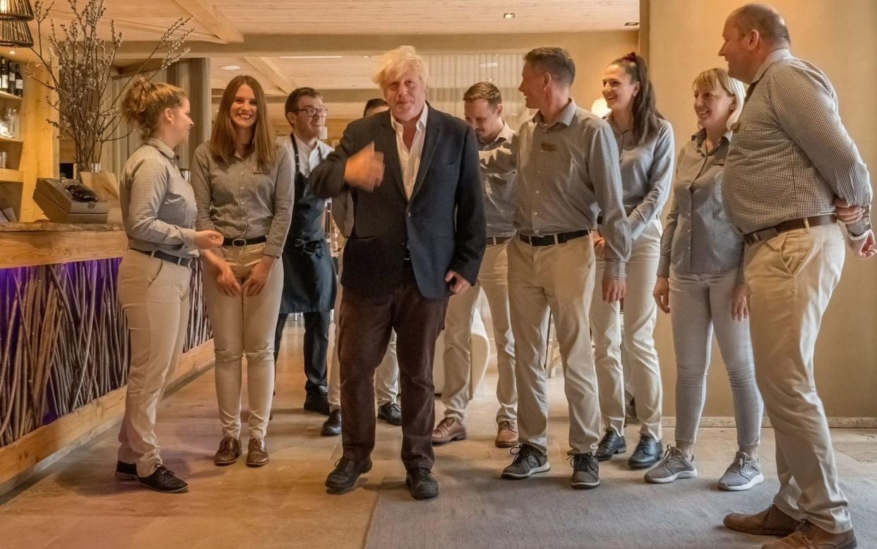 Boris Johnson with staff members of Vila Planinka - Exclusively obtained by The Telegraph