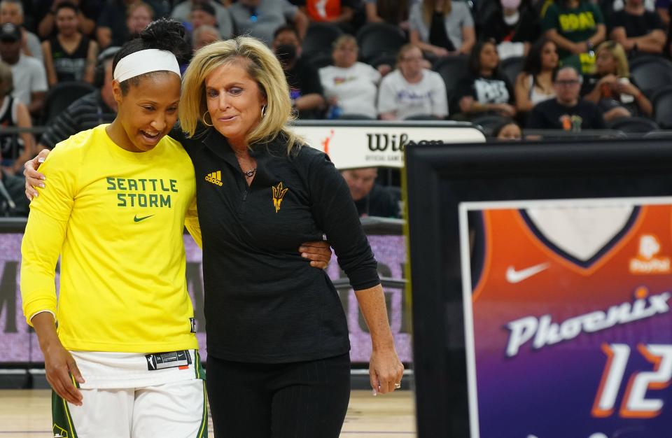 July 22, 2022;  Phoenix, Arizona; USA; Storm guard Briann January hugs former ASU college coach Charli Turner Thorne prior to the first half at the Footprint Center.