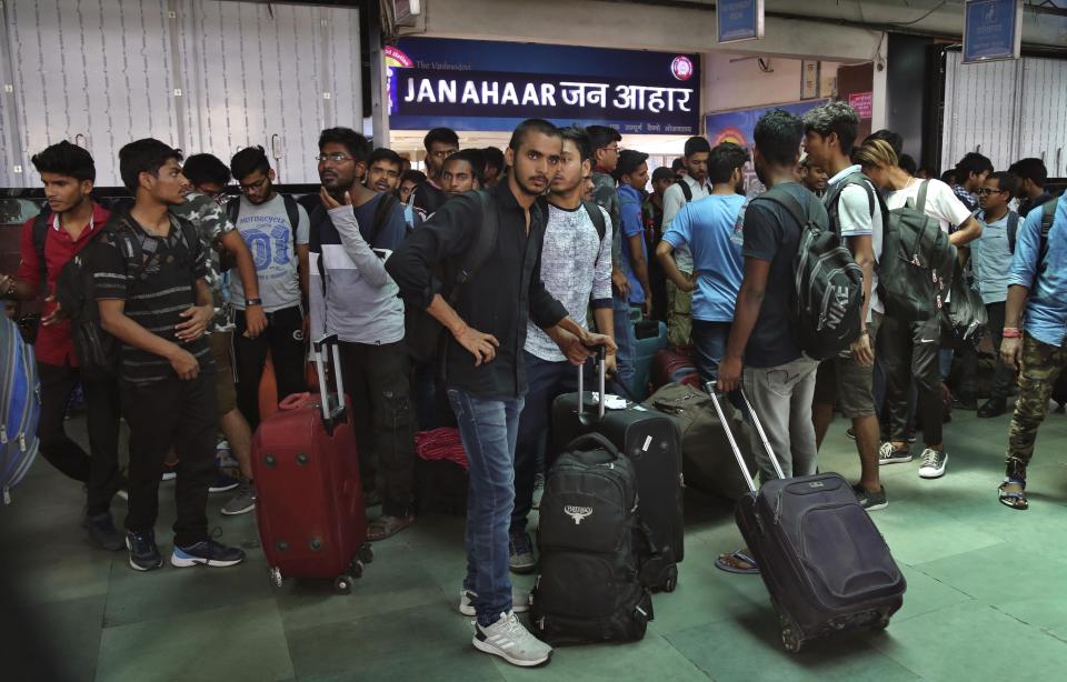 National Institute of Technology (NIT) students who left Srinagar, Kashmir's main city wait to leave for their respective homes at the railway station in Jammu, India, Sunday, Aug. 4, 2019. Thousands of Indian students and visitors were fleeing Indian-controlled Kashmir over the weekend after the government ordered tourists and Hindu pilgrims visiting a Himalayan cave shrine "to curtail their stay" in the disputed territory, citing security concerns. (AP Photo/Channi Anand)