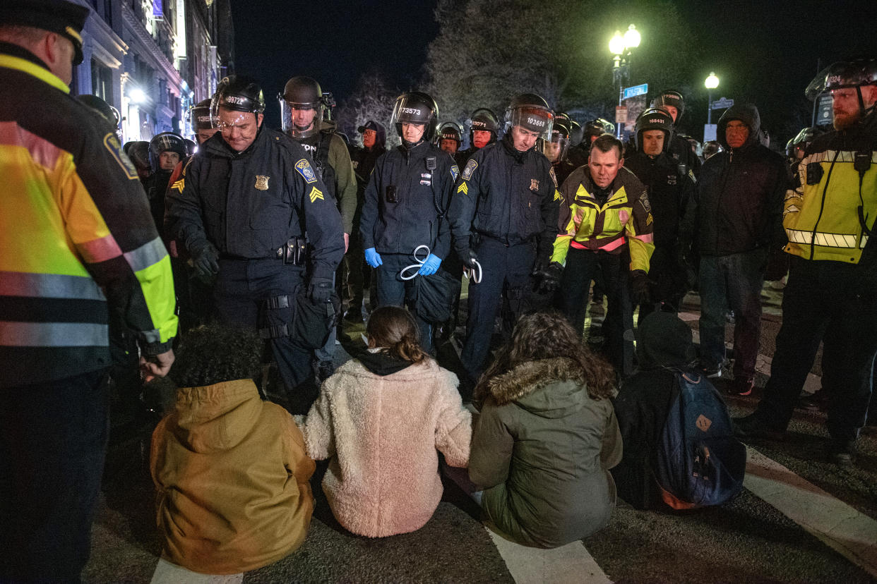Police move in to arrest pro-Palestinian supporters who were blocking the road after the Emerson College Palestinian protest camp was cleared by police in Boston on April 25