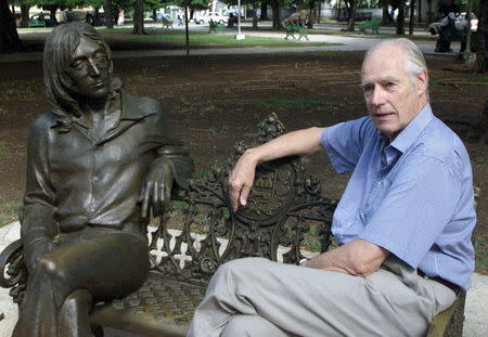 Former Beatles producer Sir George Martin visits a sculpture of John Lennon in a Havana park named after the musician, in this October 30, 2002 file photo. REUTERS/Rafael Perez/Files