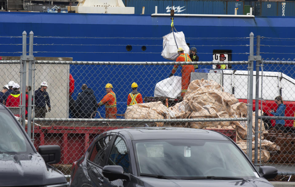 Debris from the Titan submersible, recovered from the ocean floor near the wreck of the Titanic, is unloaded from the ship Horizon Arctic at the Canadian Coast Guard pier in St. John's, Newfoundland on Wednesday, June 28, 2023. (Paul Daly/The Canadian Press via AP)