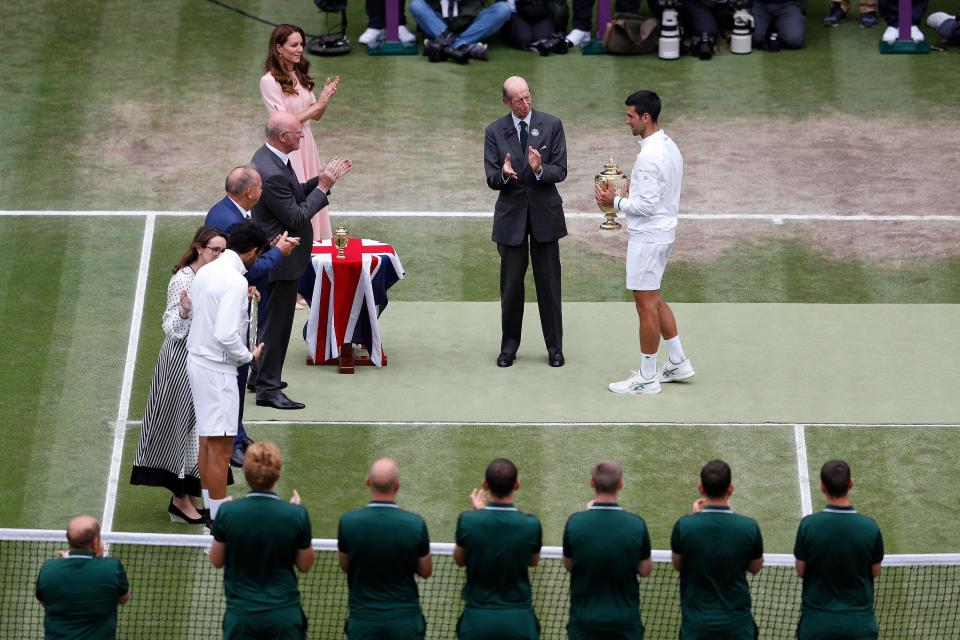 Catherine, Duchess of Cambridge, pictured here watching as Prince Edward presents Novak Djokovic with the Wimbledon trophy in 2021.