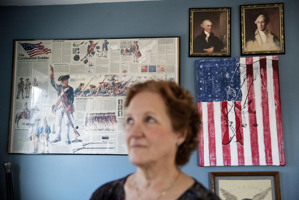 American Revolutionary War paraphernalia decorates the home of Janet Uhlar, one of 12 jurors who convicted Boston organized crime boss James "Whitey" Bulger, Friday, Jan. 31, 2020, in Eastham, Mass. "The foundational pillars of the nation, what they built the nation upon, it's all corrupted and collapsing. I think we need to admit we did this," said Uhlar. "How many people did they do this to? How many came out like Bulger?" (AP Photo/David Goldman)