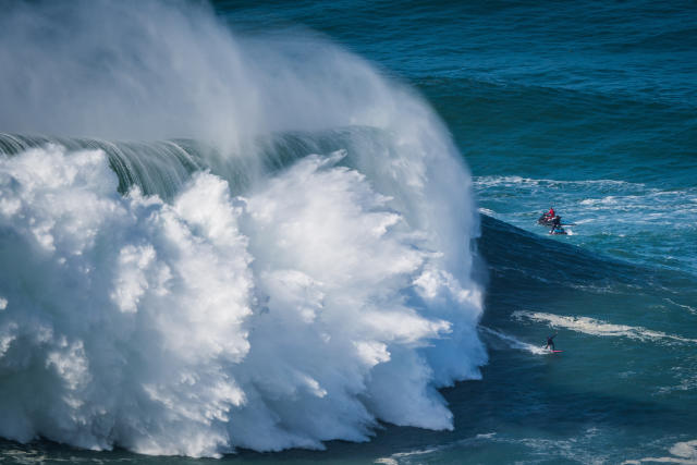 Big wave surfer Sebastian Steudtner from Germany rides a wave during a tow  surfing session at Praia do Norte on the first big swell of winter season.  (Photo by Henrique Casinhas /