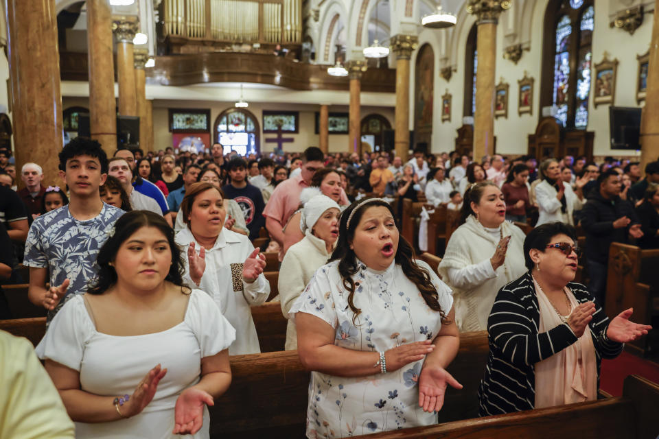 Parishioners attend Easter Mass at Sacred Heart of Jesus and Saint Patrick, Sunday, March 31, 2024, in Baltimore, Md. (AP Photo/Julia Nikhinson)