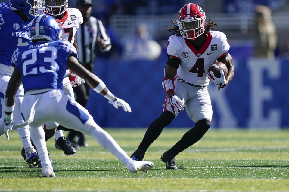 Georgia running back James Cook (4) runs with the ball during the first half of an NCAA college football game against Kentucky, Oct. 31, 2020, in Lexington, Ky. (AP Photo/Bryan Woolston)