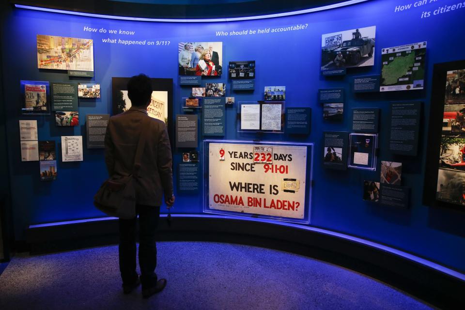 A man stands in the historical exhibition section of the National September 11 Memorial & Museum during a press preview in New York May 14, 2014. A museum commemorating the Sept. 11, 2001 attacks on New York and Washington is on the verge of opening, with wrenchingly familiar sights as well as artifacts never before on public display. Among the first visitors to the National September 11 Memorial Museum are victims' family members and others intimately involved in its creation who will attend on Thursday, after a Wednesday media preview. The doors open to the general public on May 21. (REUTERS/Shannon Stapleton)