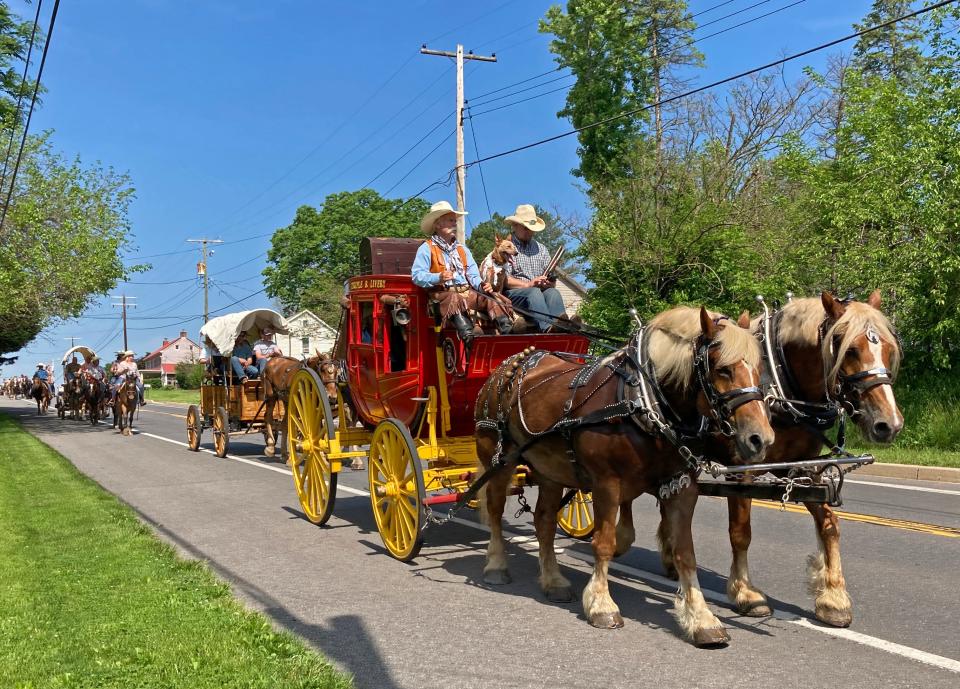 This file photo shoes a participant in the James Shaull Wagon Train making its way east along National Pike at Spickler Road as a part of the annual National Pike Festival.