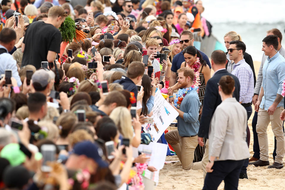 Meghan and Harry meet crowds at Bondi. Photo: Getty