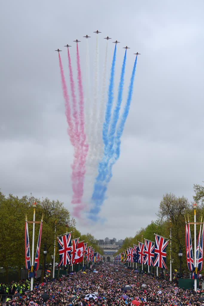 The Royal Air Force Aerobatic Team otherwise known as The Red Arrows fly over The Mall